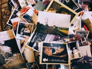 a pile of photo prints of various sizes